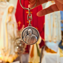 Load image into Gallery viewer, Pope Francis Keychain - Silver keychain with a circular pendant featuring an engraved portrait of Pope Fracis and the Apparitions of Fatima
